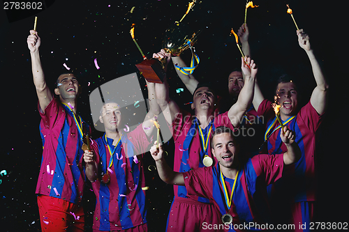 Image of soccer players celebrating victory