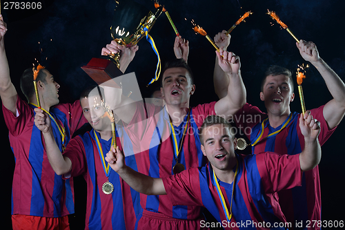 Image of soccer players celebrating victory