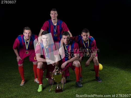 Image of soccer players celebrating victory