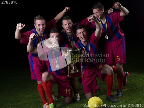 Image of soccer players celebrating victory