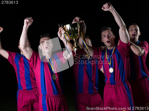 Image of soccer players celebrating victory