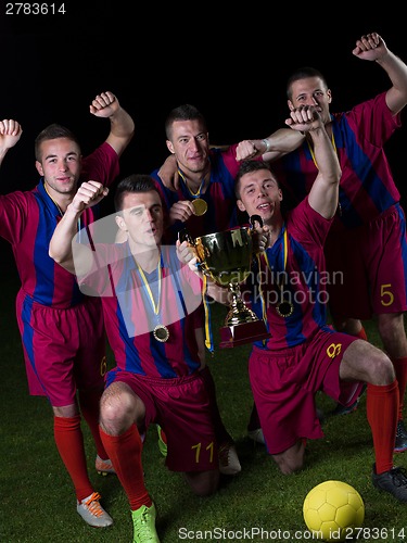 Image of soccer players celebrating victory