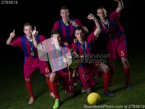 Image of soccer players celebrating victory