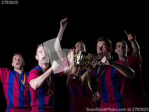 Image of soccer players celebrating victory