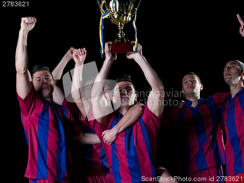 Image of soccer players celebrating victory