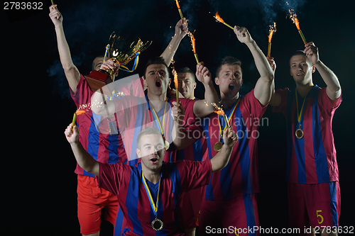 Image of soccer players celebrating victory