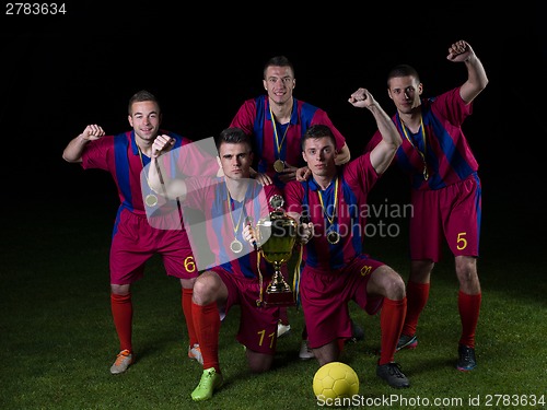 Image of soccer players celebrating victory