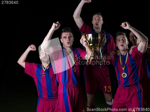 Image of soccer players celebrating victory