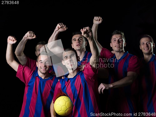 Image of soccer players celebrating victory