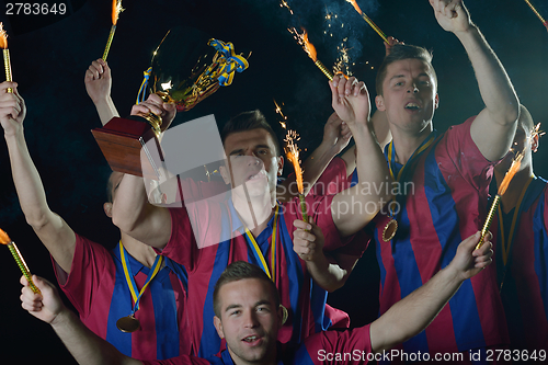 Image of soccer players celebrating victory