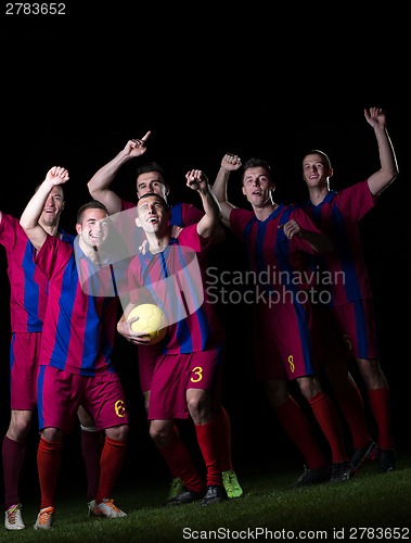 Image of soccer players celebrating victory