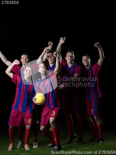 Image of soccer players celebrating victory