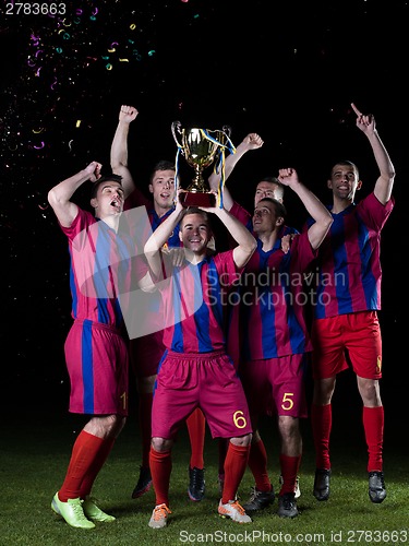 Image of soccer players celebrating victory