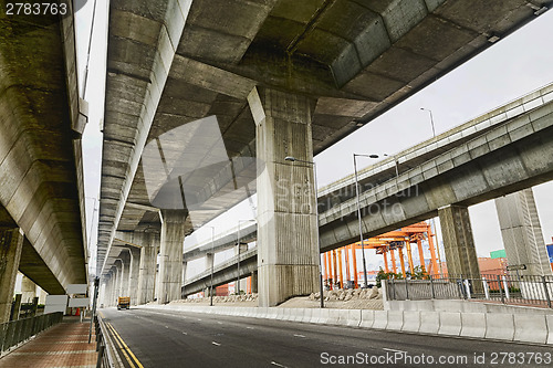 Image of Empty asphalt road under the new expressway line. 