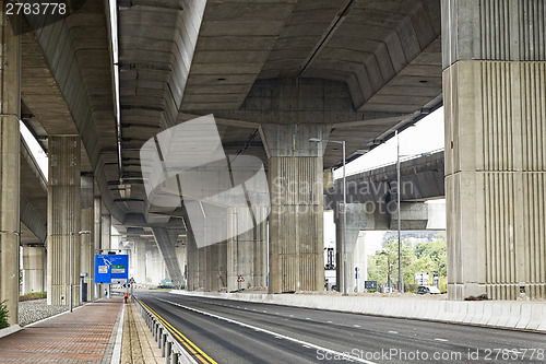 Image of Empty asphalt road under the new expressway line. 