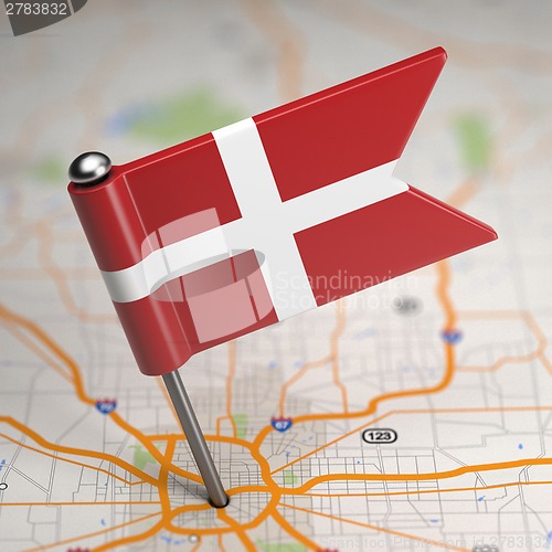 Image of Order of Malta Small Flag on a Map Background.