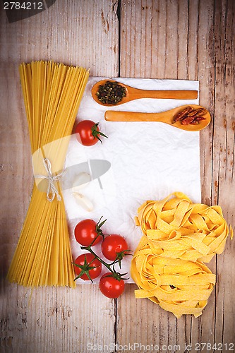 Image of uncooked pasta with tomatoes and spices