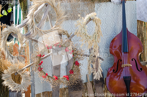 Image of dried oats rye berry wreath composition near bass 