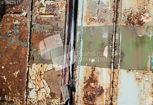 Image of close up of old rusty metal bus door background 