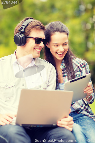 Image of students or teenagers with laptop computers