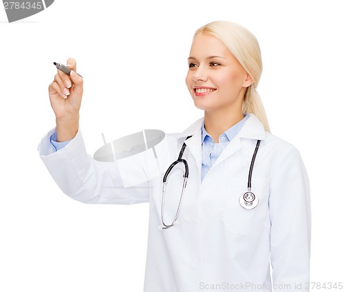 Image of female doctor working with something imaginary