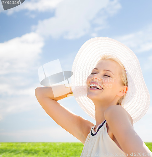 Image of beautiful woman enjoying summer outdoors