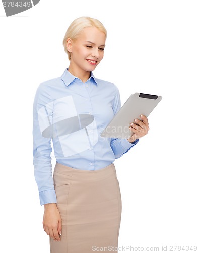 Image of smiling woman looking at tablet pc computer