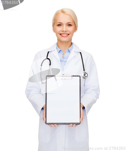 Image of smiling female doctor with clipboard