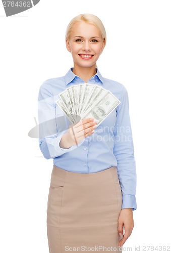 Image of young businesswoman with dollar cash money