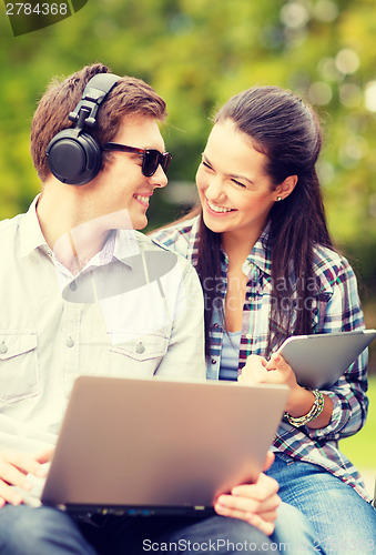 Image of students or teenagers with laptop computers