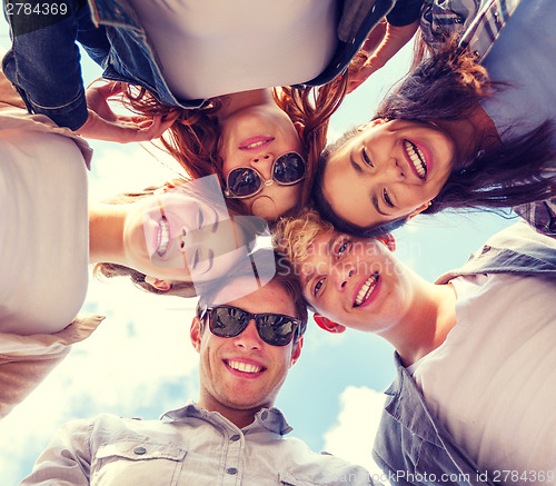 Image of group of teenagers looking down