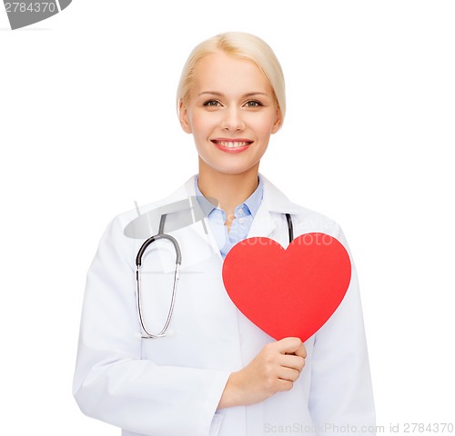 Image of smiling female doctor with heart and stethoscope