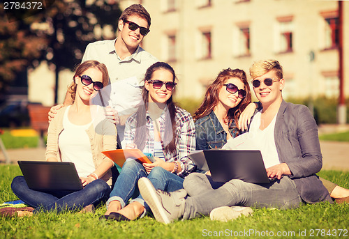 Image of students or teenagers with laptop computers