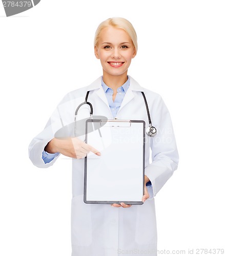 Image of smiling female doctor with clipboard