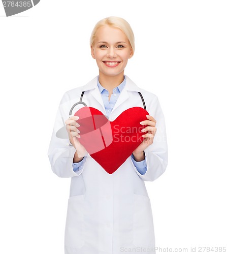 Image of smiling female doctor with heart and stethoscope