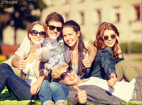 Image of group of students or teenagers showing thumbs up