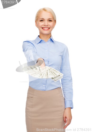 Image of young businesswoman with dollar cash money