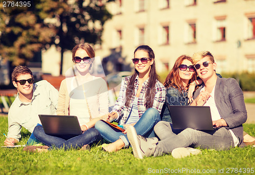 Image of students or teenagers with laptop computers