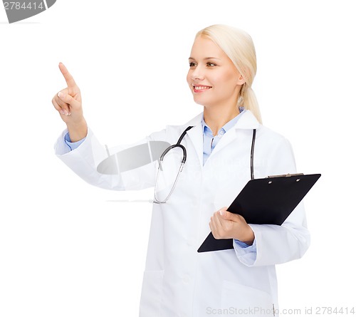 Image of smiling female doctor pointing to something