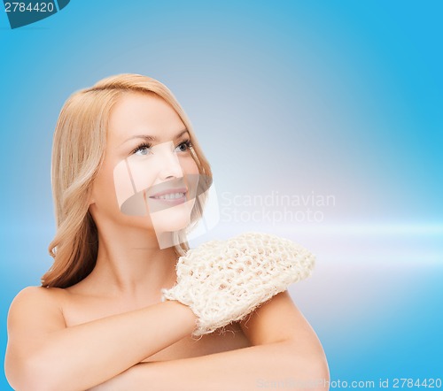 Image of smiling woman with exfoliation glove