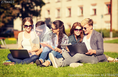 Image of students or teenagers with laptop computers