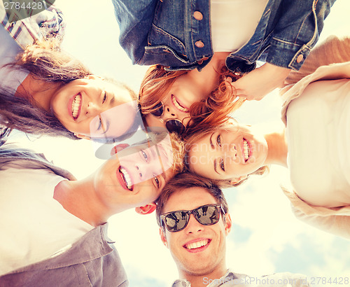 Image of group of teenagers looking down