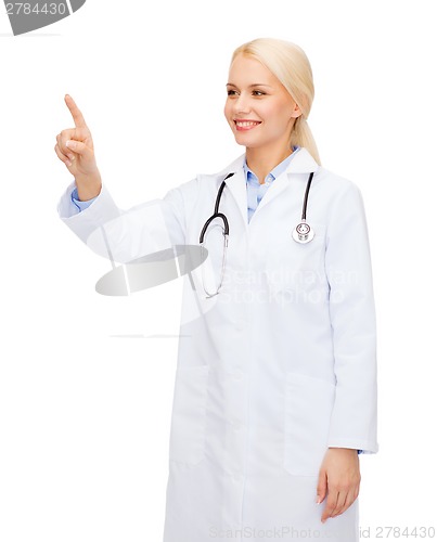 Image of smiling female doctor pointing to something