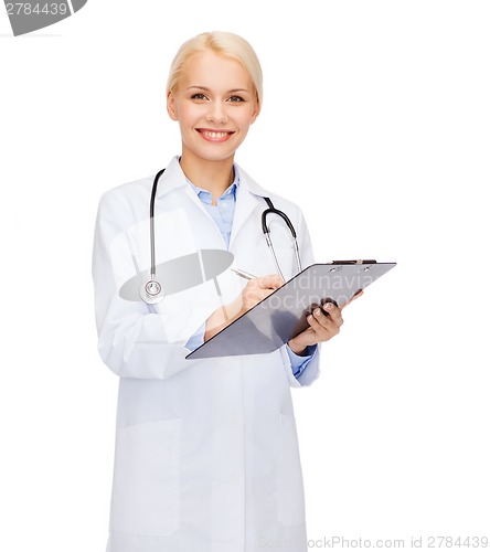 Image of smiling female doctor with clipboard