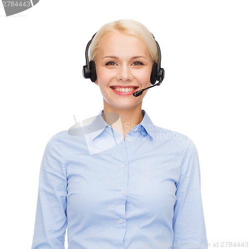 Image of friendly female helpline operator with headphones