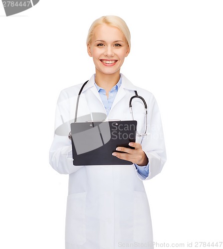 Image of smiling female doctor with clipboard