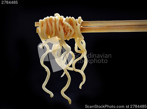 Image of Chopsticks with noodles