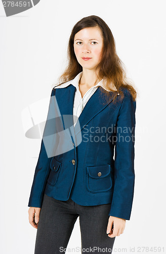 Image of serious woman in blue jacket standing