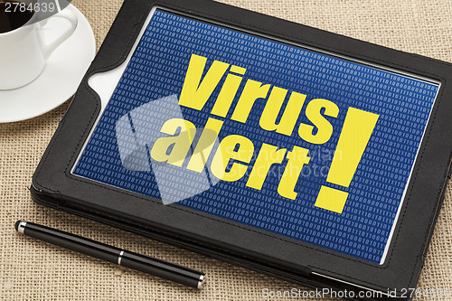 Image of virus alert on digital tablet