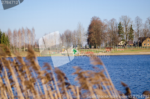 Image of view from bent to beach with children playground  